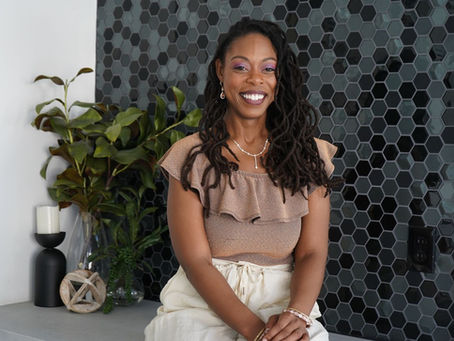 Portrait of Megan Dee Ann smiling warmly, representing a purposeful brand relaunch and personal update