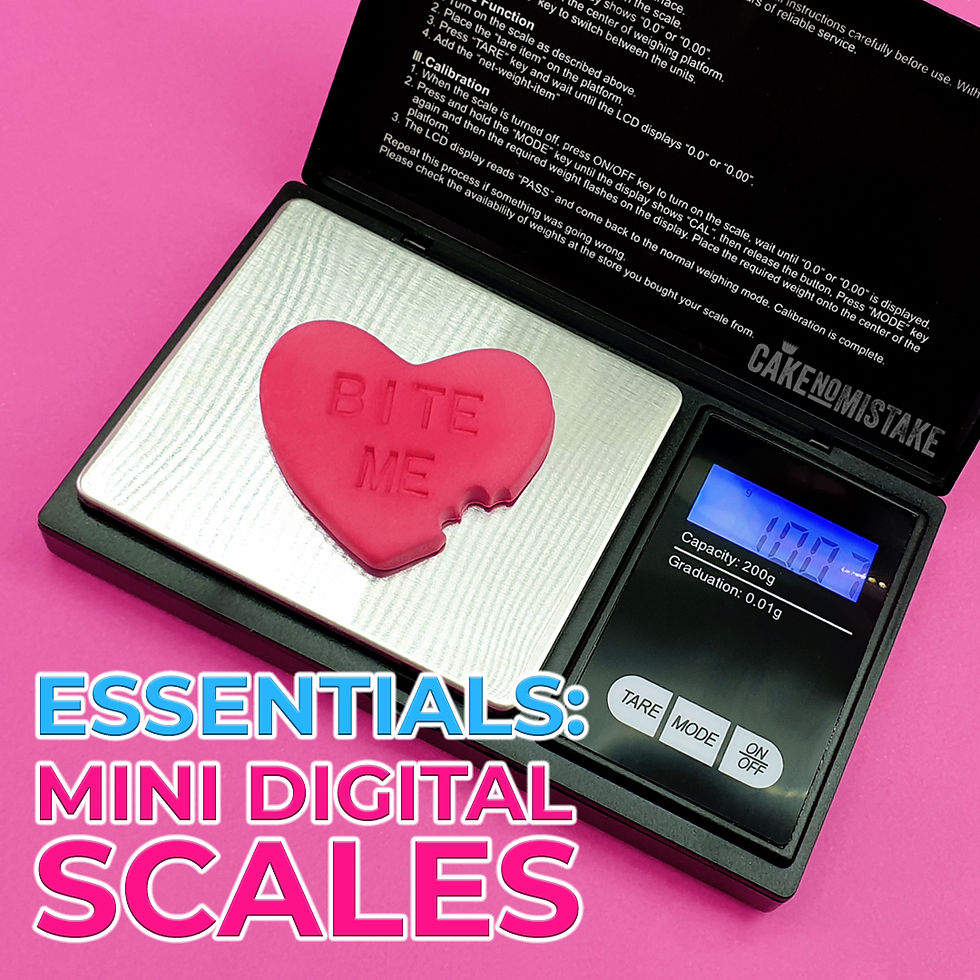 Mini digital scales weighing a sugar paste heart topper.