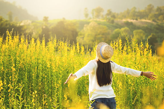 portrait of happy beautiful happy youngwoman relaxing in park. Joyful female model breathi