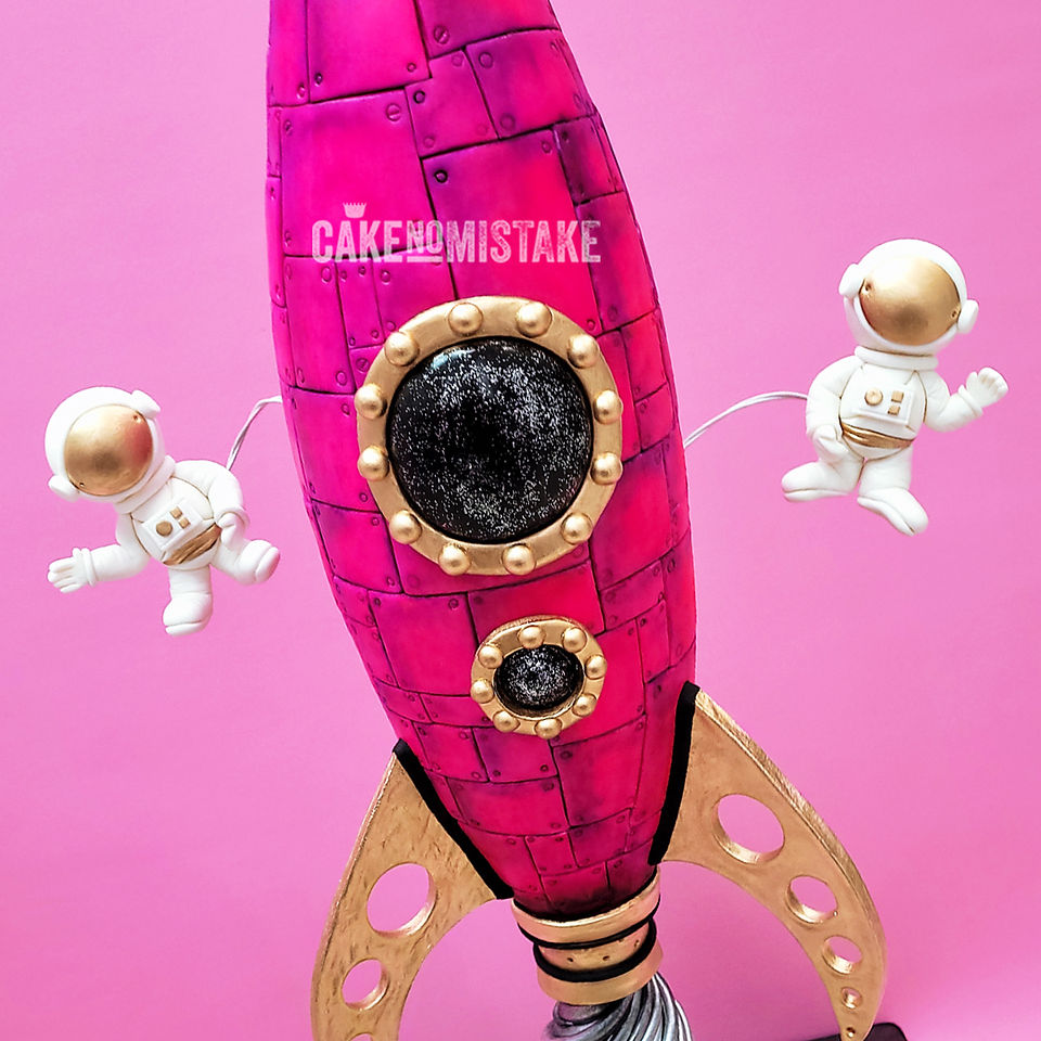 Hot pink rocket with astronauts 