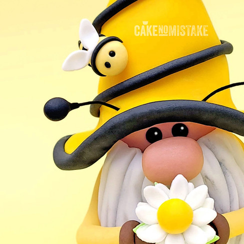 Yellow bee gnome with antennas and daisy