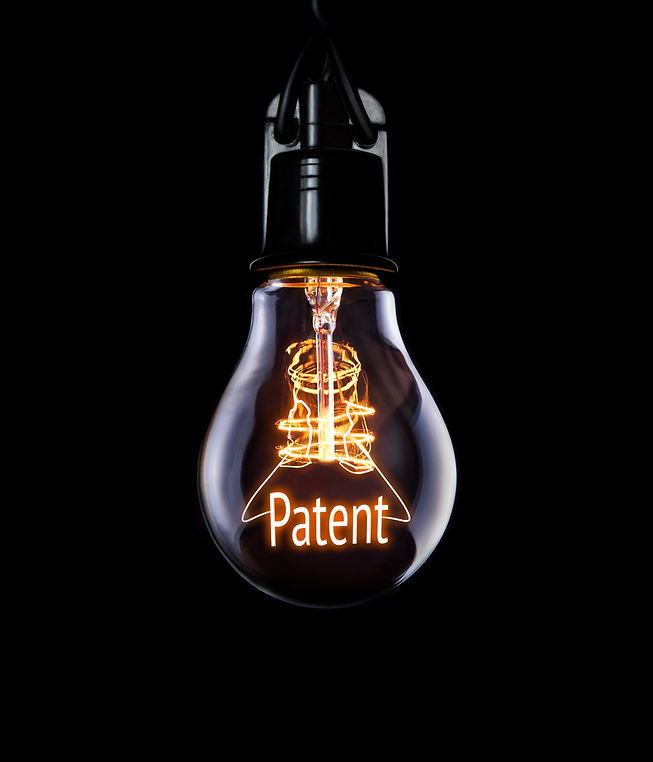 Hanging lightbulb with glowing Patent concept..jpg