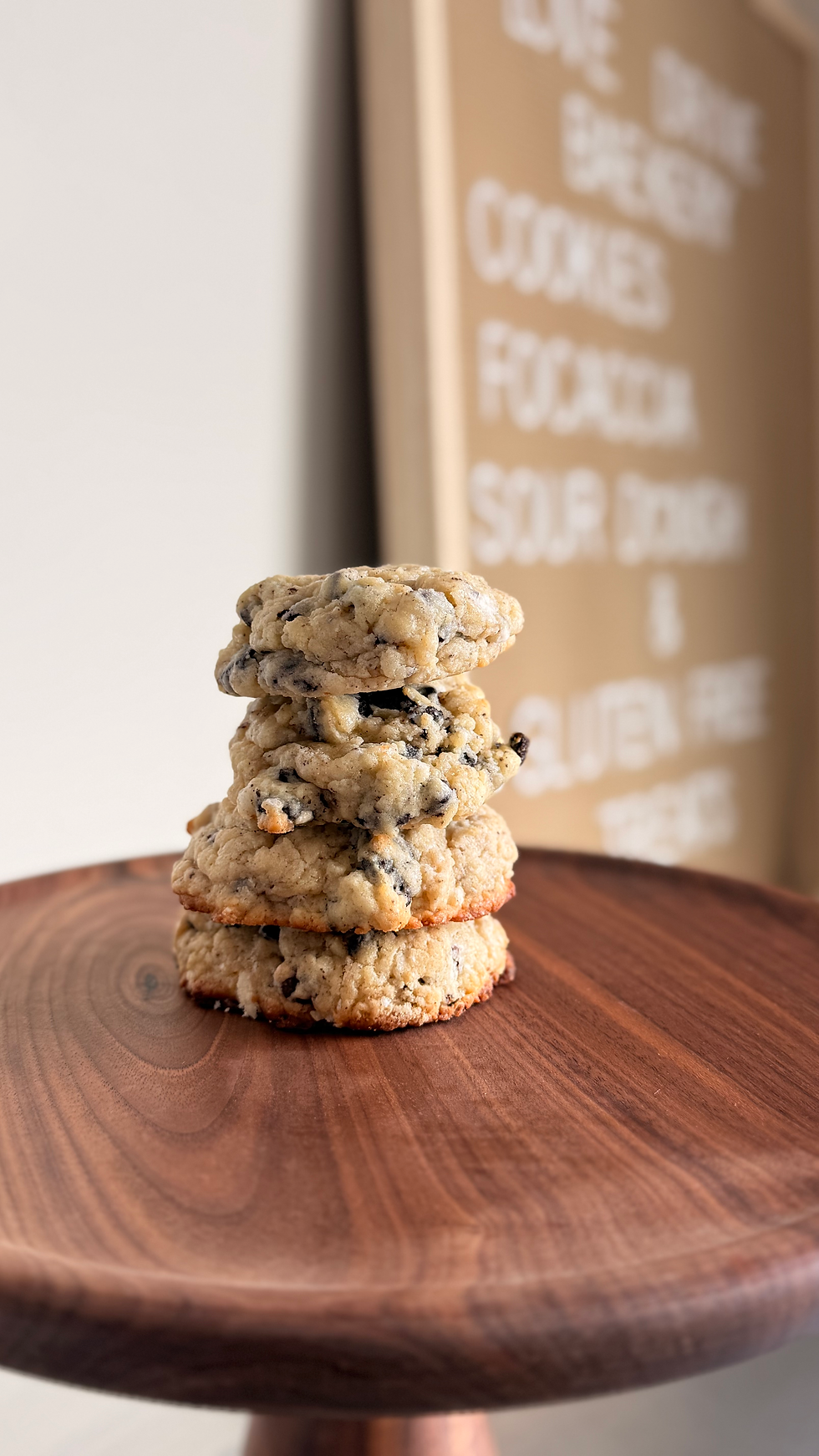 Eye-level view of cookies and cream drops on a festive plate