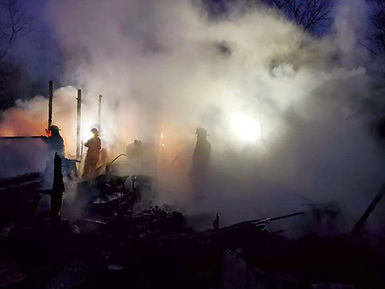Smokey with fire fighters.jpg