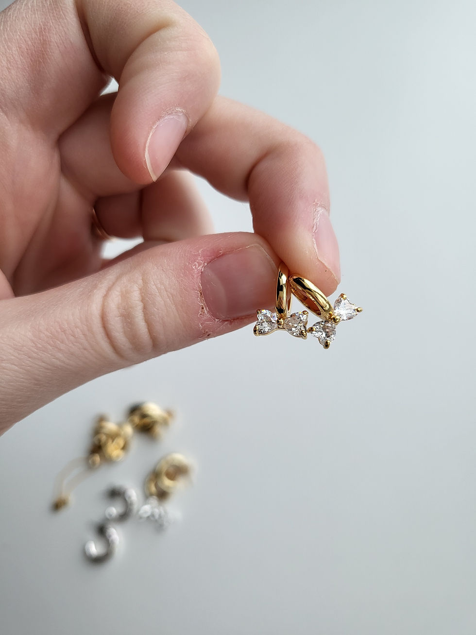 Thumbnail: Gold Sparkly Bow Huggies
