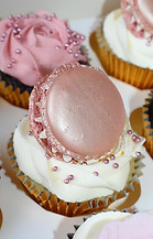 Picture of a cupcake with macaron on top