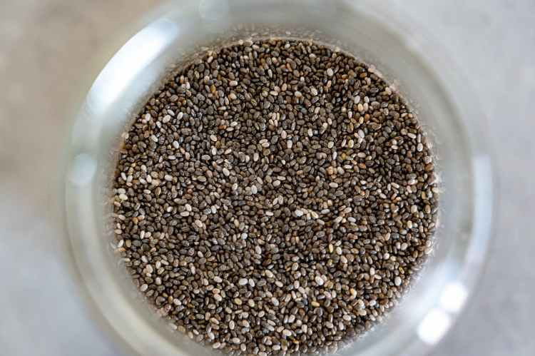 A bowl of brown flax seeds which is nature's best phytoestrogens and will help with hormone balance.