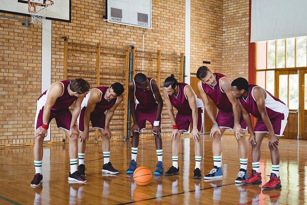 basketball-players-taking-a-break-on-basketball-court-e1624193472122.jpeg