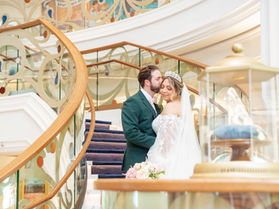 Bride and Groom Portraits in Grand Hall of Disney Wish by Disney cruise Wedding photographer Adrianna Gunn