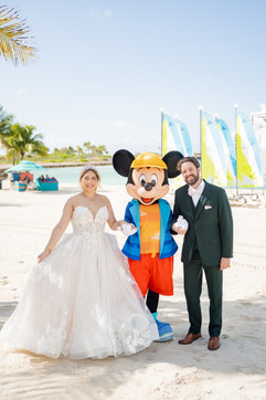 Bride and Groom Portraits with Mickey Mouse on the Disney Wish by Disney Cruise Wedding Photographer Adrianna Gunn