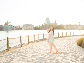 Sunshiny senior session at Disney's Boardwalk, Beach Club, and Yacht Club Resorts with Disney Photographer Adrianna Gunn.
