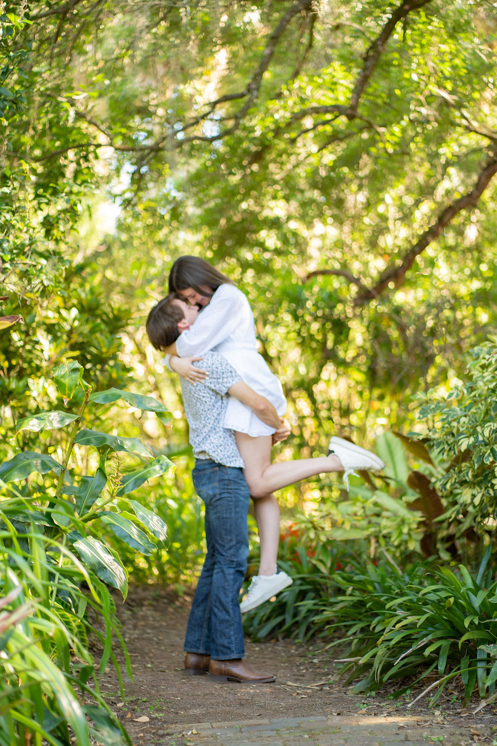 Surprise Proposal and Engagement photoshoot at Harry P Leu Gardens in Orlando, Florida