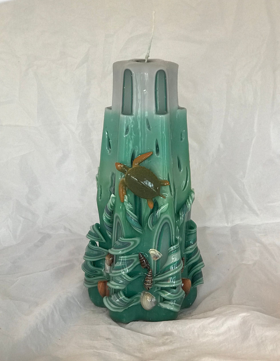 Hand carved lighthouse candle with turtle