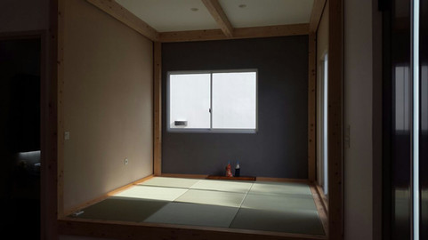 Japanese-style sitting corner with tatami floor.