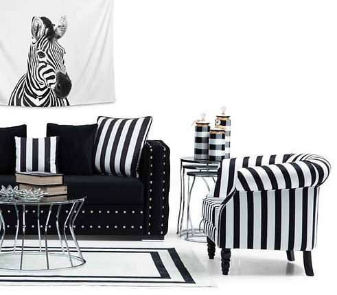 Black and white striped sofa and armchair in a modern living room interior