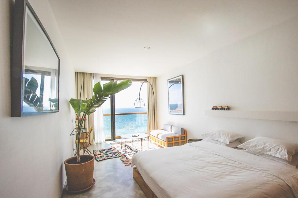 room with ocean view from balcony in amouage hotel by surf maroc in taghazout