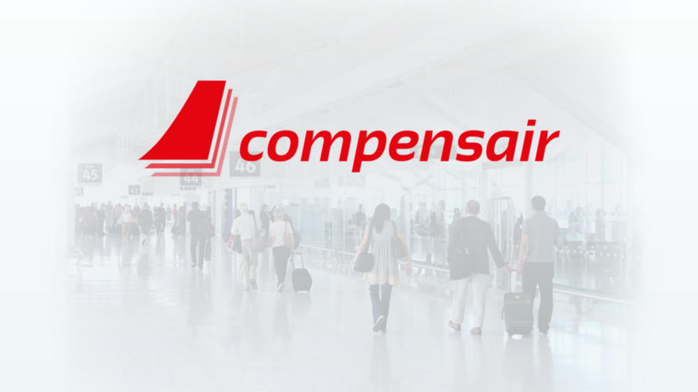Red ‘compensair’ logo over a busy airport terminal with travelers, luggage, and visible gates. Bright, airy atmosphere.