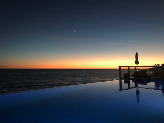 amouage hotel swimming pool at sunset in taghazout