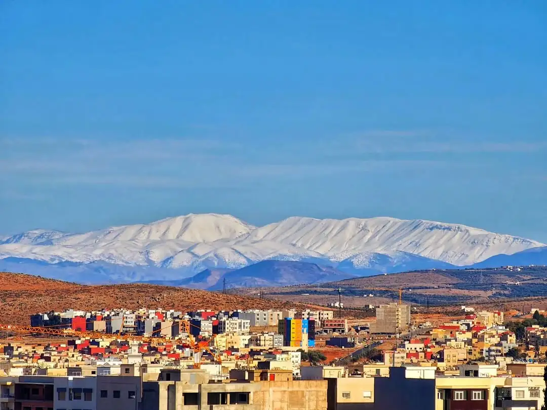 WIDE VIEW OF THE CITY OF SEFROU WITH SURROUNDING ATLAS MOUNTAINS