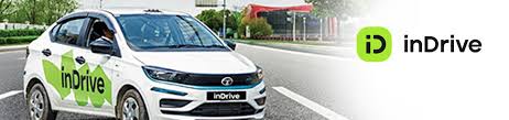 White car with ‘inDrive’ logo on the side, driving on a road in morocco.