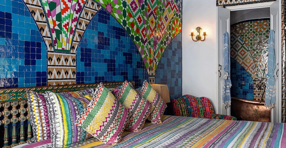 Colorful Moroccan bedroom at Salut Maroc Riad in Essaouira Morocco
