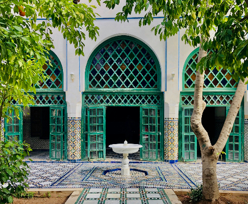 marrakech in the spring: a riad interface with lush greenery.