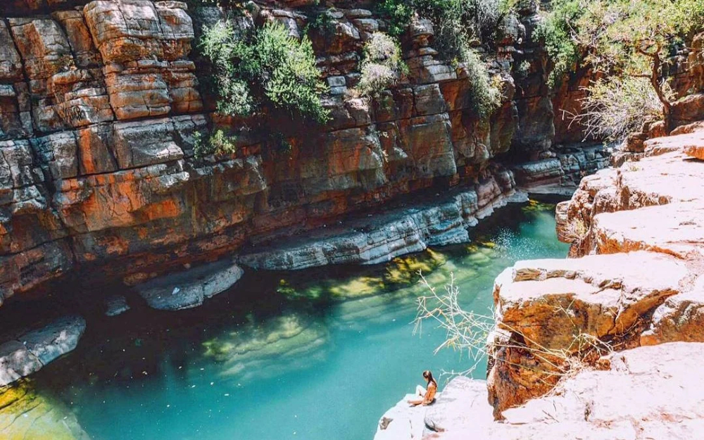 a girl enjoying the sun by the blue water in paradise valley near agadir morocco