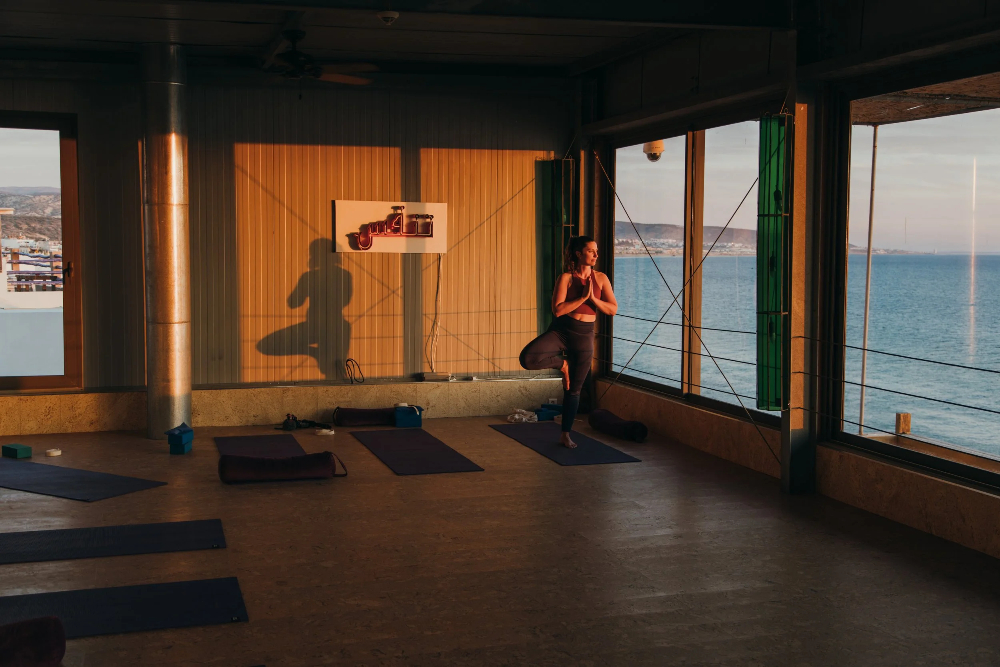 woman relaxing and enjoying yoga in amouage hotel in taghazout