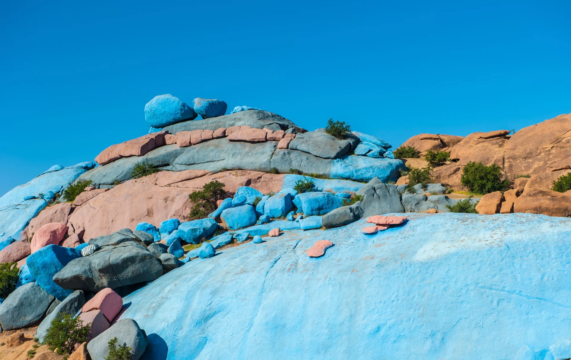 Blue and colorful rocks made by artists in the town of tafraoute Morocco