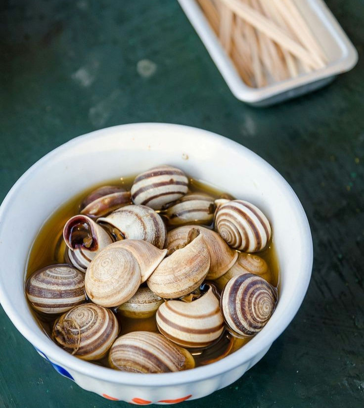 Moroccan snails soup with toothpicks for eating