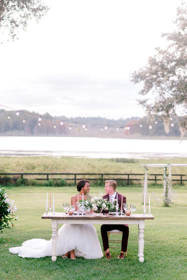 Bride and groom making a grand entrance into their wedding reception instead of a grand exit, captured by Sarasota wedding photographer Nina Bashaw.