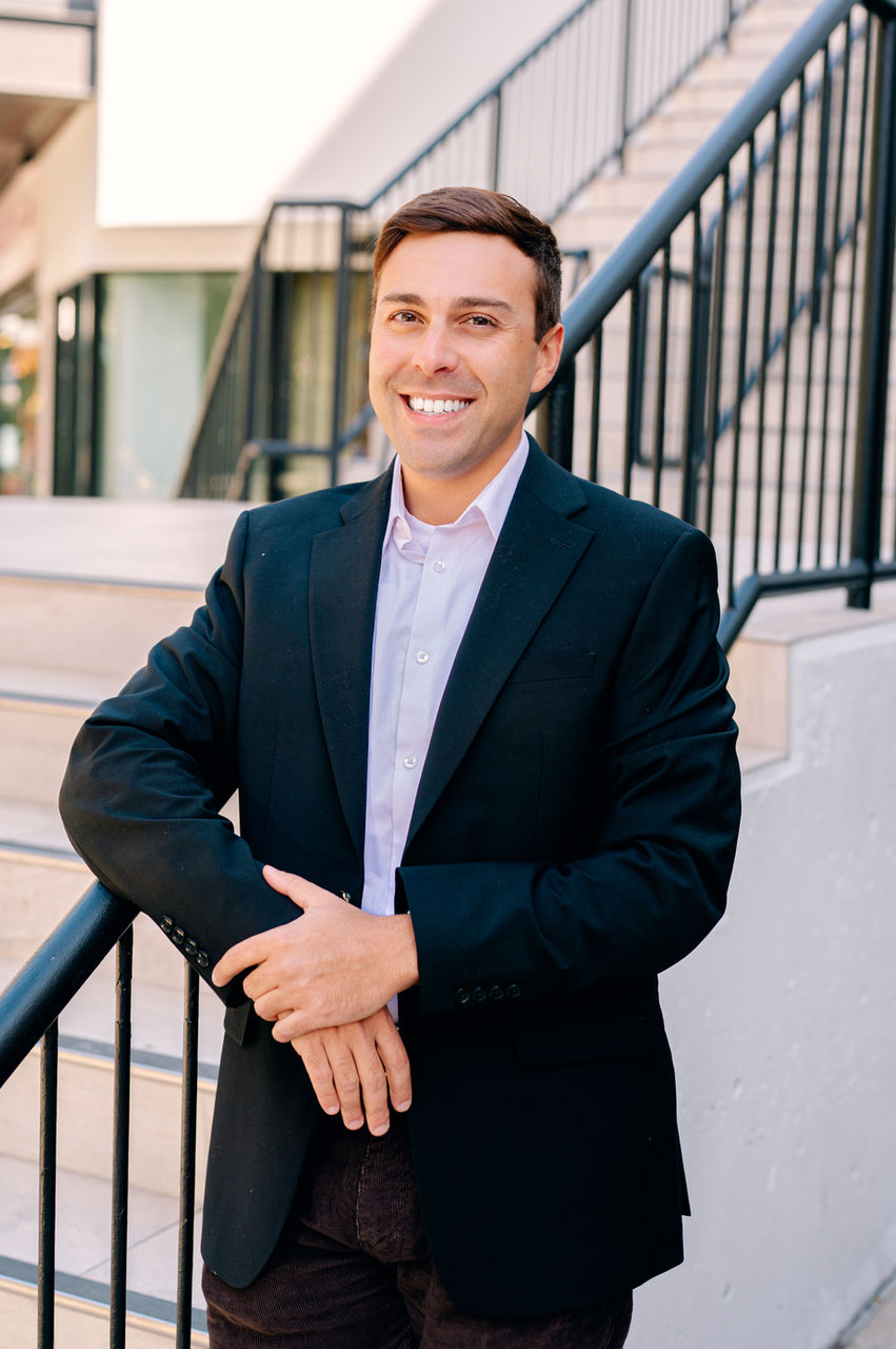 Modern professional portrait taken in Hyde Park Village with a refined, minimal aesthetic and genuine expression, created by Tampa headshot photographer Nina Bashaw for LinkedIn profiles, personal branding, and online business presence.