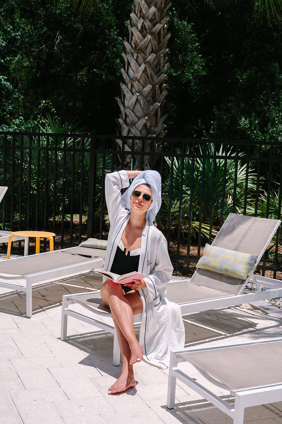 Editorial pool portrait in Tampa with reflective water and dramatic natural light