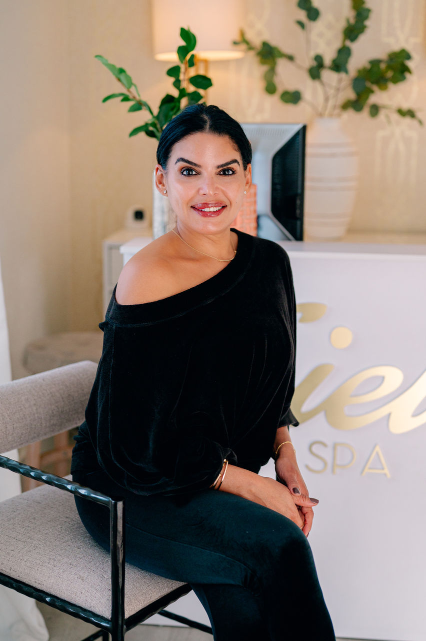 Approachable branding portrait of Krissy Alpagut with warm tones and soft shadows showing a calm professional presence.