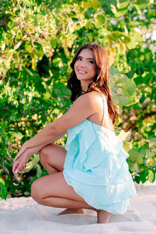 Senior girl standing on beach at sunset at Grand Hyatt Tampa Bay