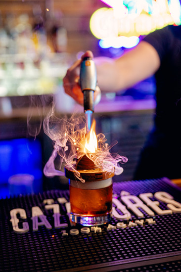 Behind the scenes kitchen action captured in natural light by Tampa food and branding photographer Nina Bashaw during a food photography session