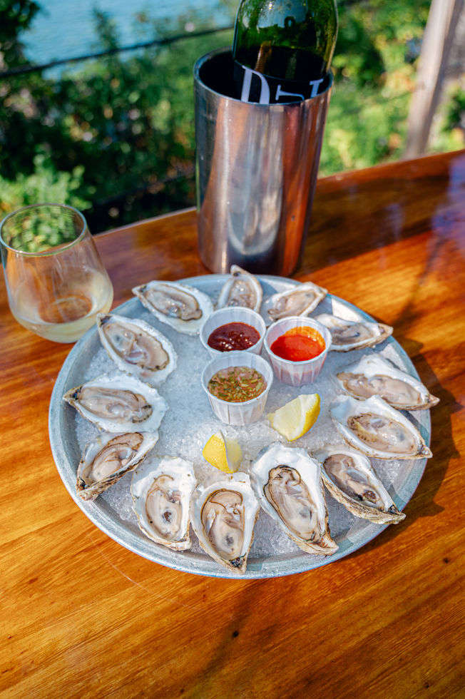 Fresh oysters served outdoors at Abel’s Lobster Pound in Bar Harbor. Photographed by Nina Bashaw