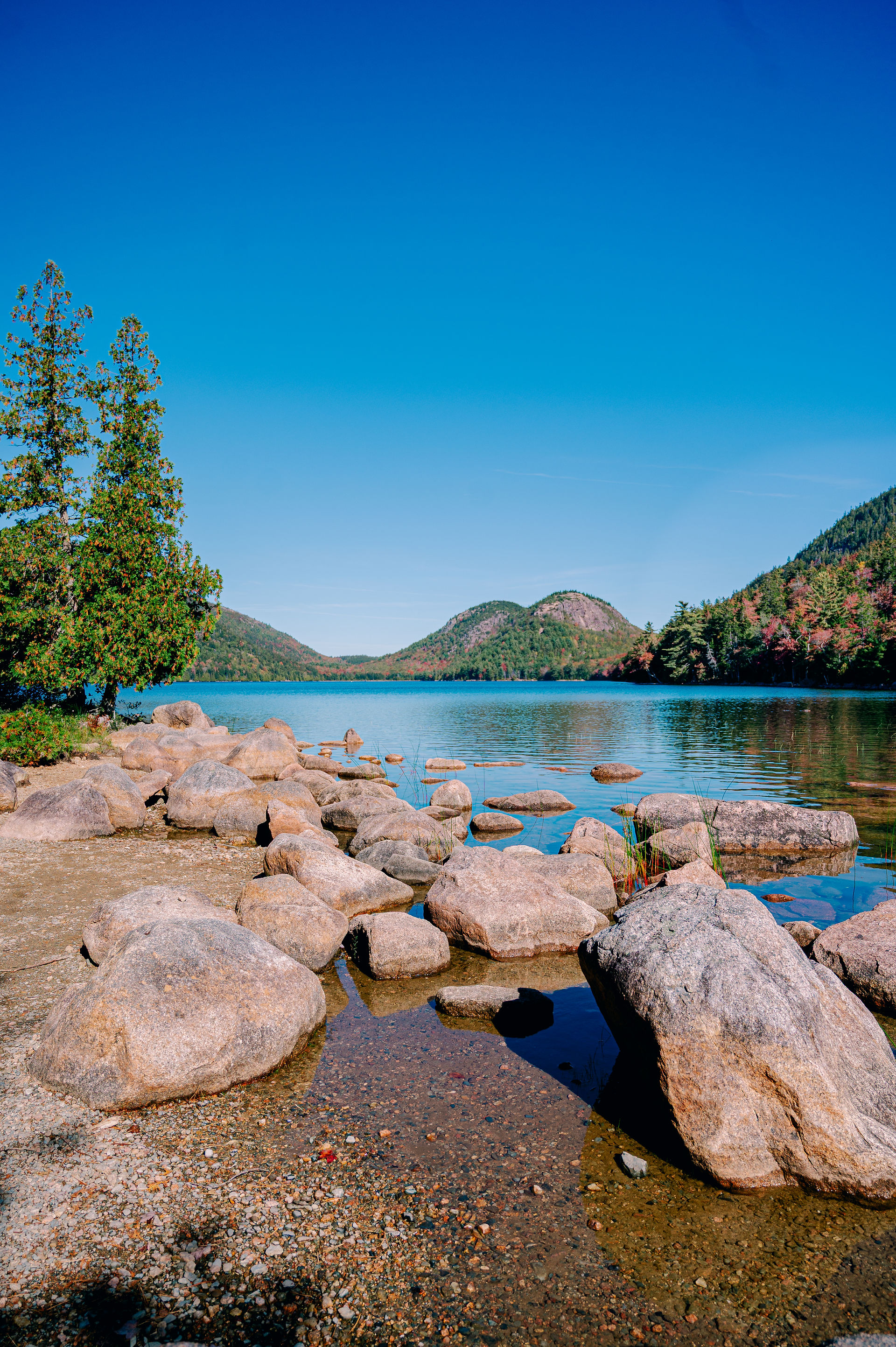 Jordan Pond in Acadia National Park with mountain reflections captured by photographer Nina Bashaw