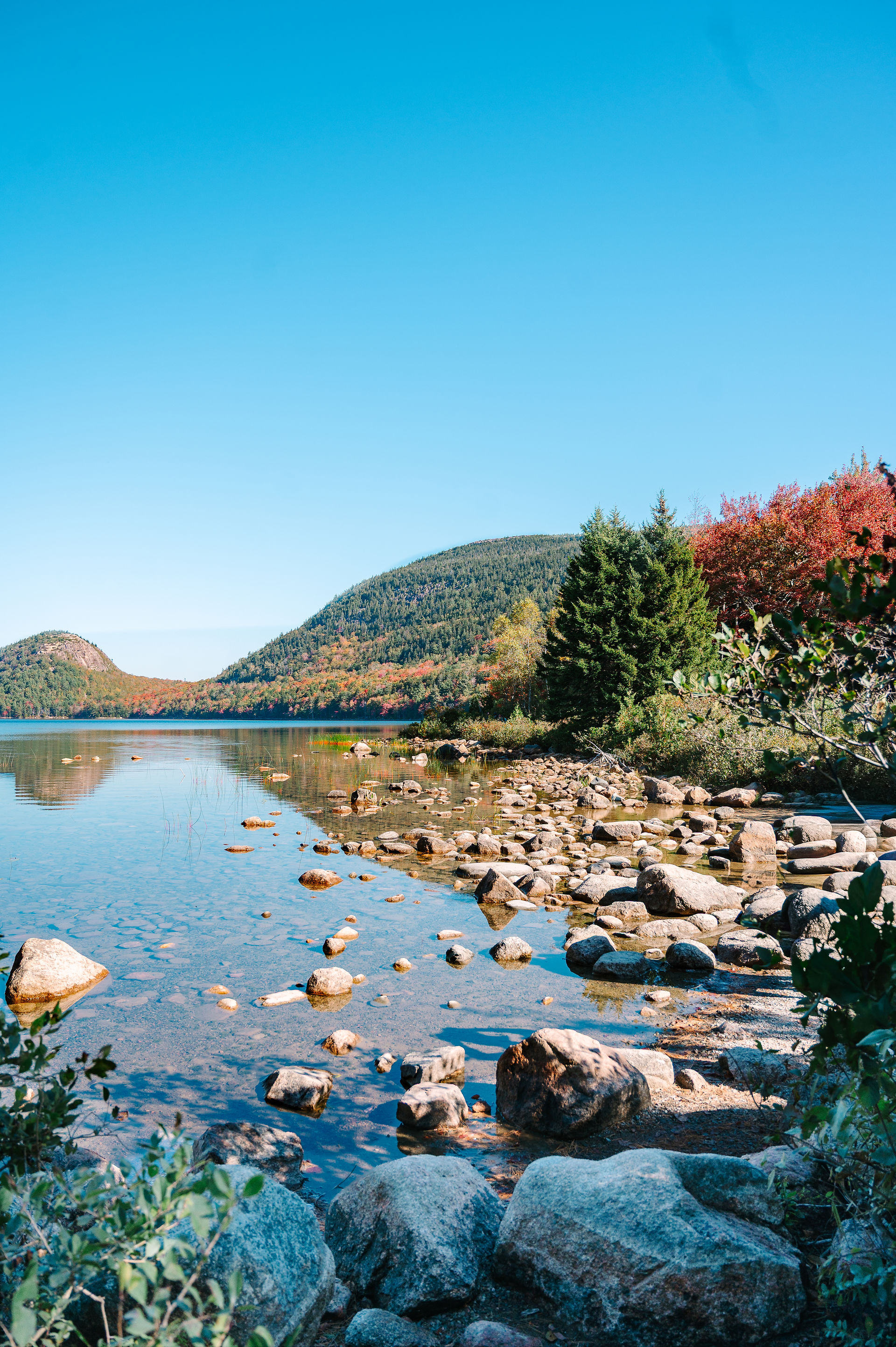 Wide view of Jordan Pond and surrounding mountains in Acadia National Park by photographer Nina Bash