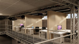 Modern office with desks, computers, and lighting fixtures