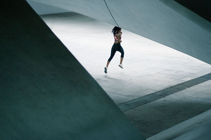 Girl Running in Urban Scenery