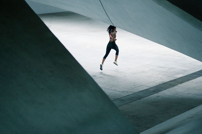 Girl Running in Urban Scenery