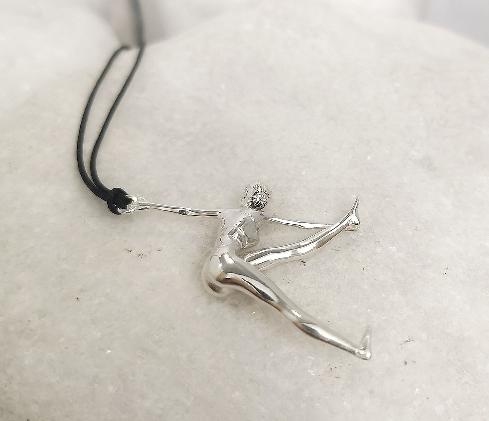 Thumbnail: ÉROS | Parivritta Trikonasana, yoga pendant