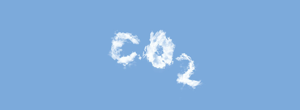 Clouds form letters "CO2" against a clear blue sky, highlighting environmental awareness and climate change themes. India Carbon Market 2026