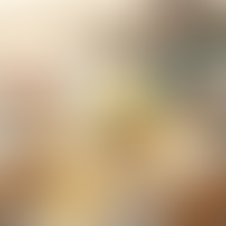 Eye-level close-up studio shot on a pristine white marble countertop, showcasing a premium tall frosted glass bottle of Andreatta limoncello with exactly as the attached image reference. The bottle is the hero, adorned with exquisite, realistic condensation droplets, emphasizing its perfectly chilled state. The vibrant, luminous yellow liquid of the limoncello glows from within the bottle, suggesting its rich, natural color. Surrounding the bottle are meticulously arranged, fresh Sicilian lemons – some whole, some perfectly halved to reveal their juicy interior, and a delicately curled strip of bright yellow lemon peel, highlighting its zest and textured surface. Soft, natural window light illuminates the scene from the side, creating subtle highlights and gentle shadows that enhance the bottle's frosted texture and the fruit's natural imperfections