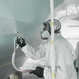 Technician applying ceramic coating to yacht – ALMAR ProPainting precision detailing.