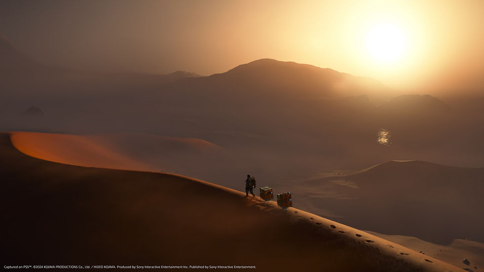 A person walks on sand dunes at sunrise, followed by robotic carriers. The scene is serene, with warm orange hues and a vast desert backdrop.