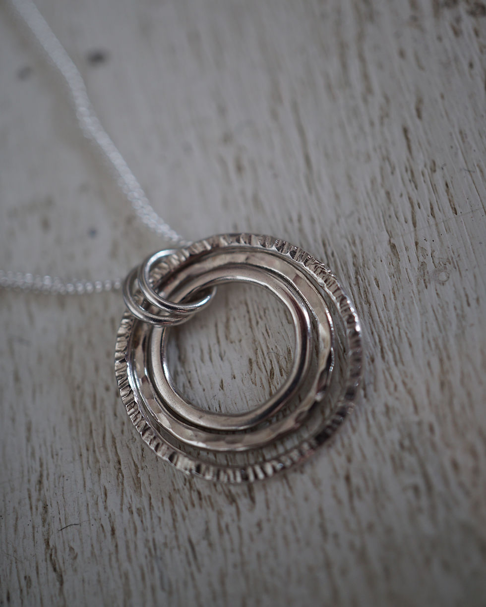 Thumbnail: Trio of Hammered Silver Rings Pendant