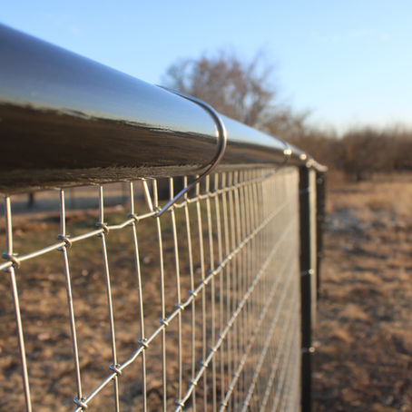 Up close new pipe fence  painted black