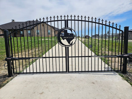 Double swing arched iron custom drive gate in parker county
